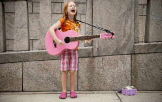 girl crying playing guitar