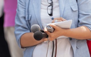 woman holding microphone